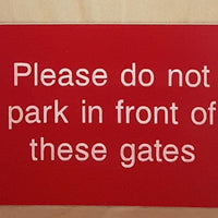 Engraved Please do not park in front of these gates sign