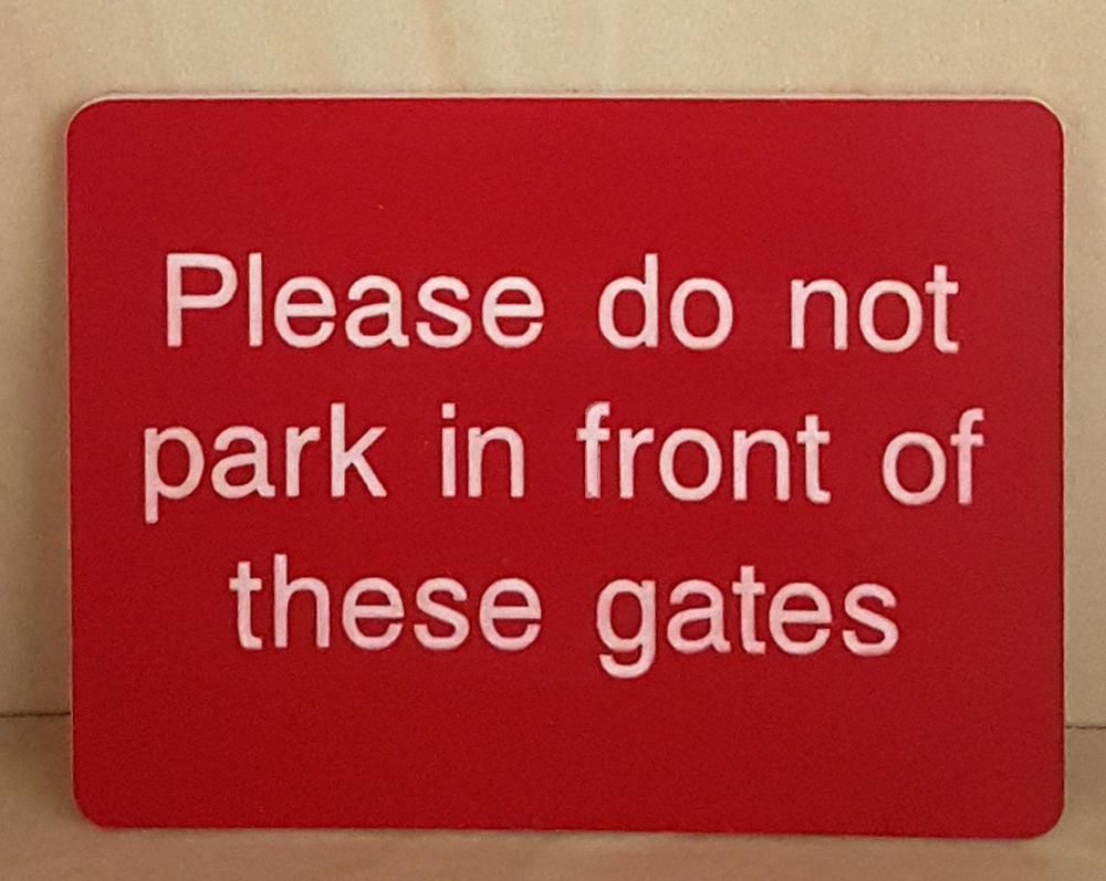 Engraved Please do not park in front of these gates sign