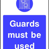 Guards Must be Used safety sign