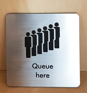 Engraved Queue here symbol sign