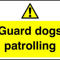 Guard dogs patrolling sign