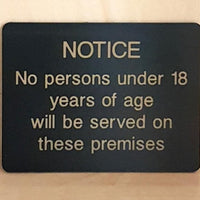 Engraved No persons under 18 will be served sign