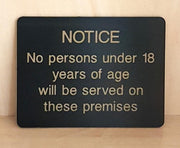 Engraved No persons under 18 will be served sign